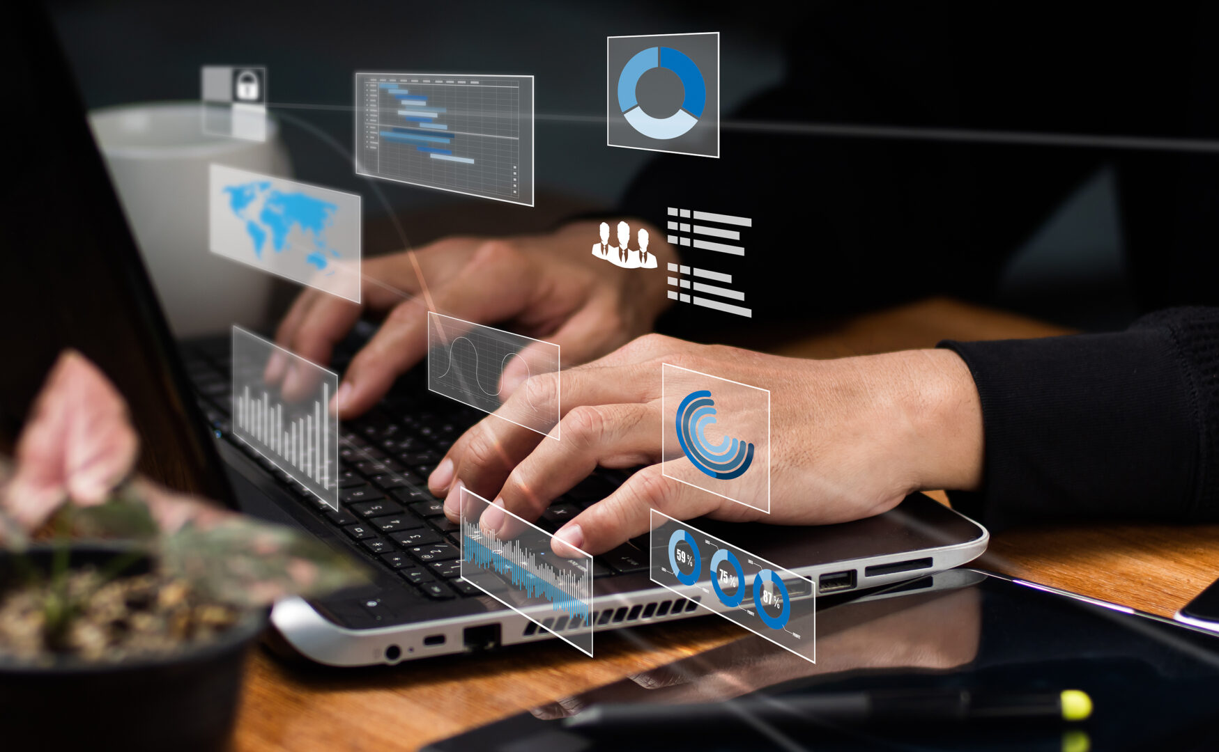 Image of a person typing on a laptop with a graphic overlay of various icons representing AI and technology