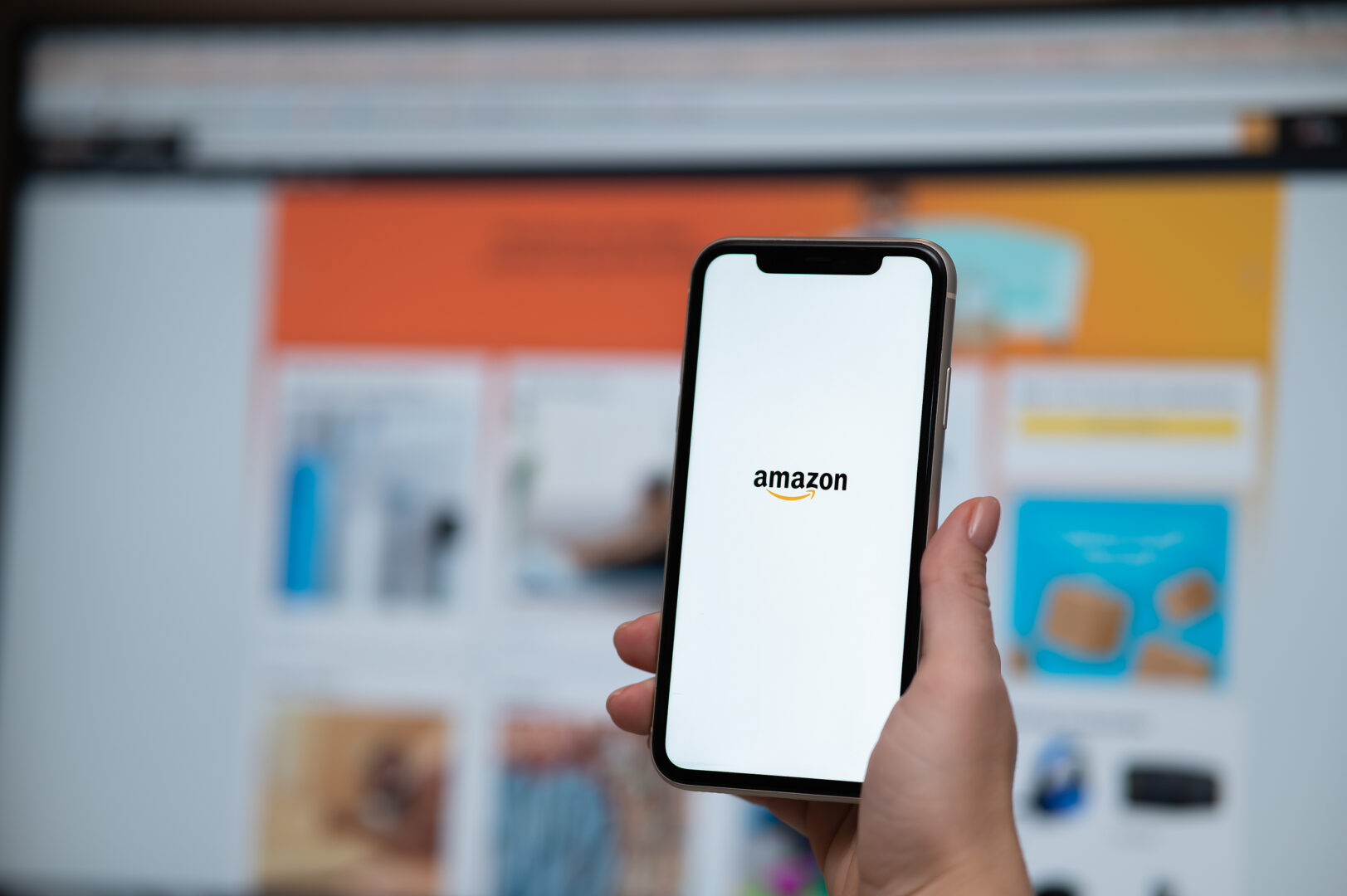 A smartphone with Amazon open on the screen